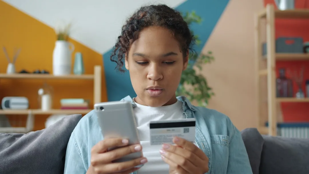 Customer making a mobile payment at home