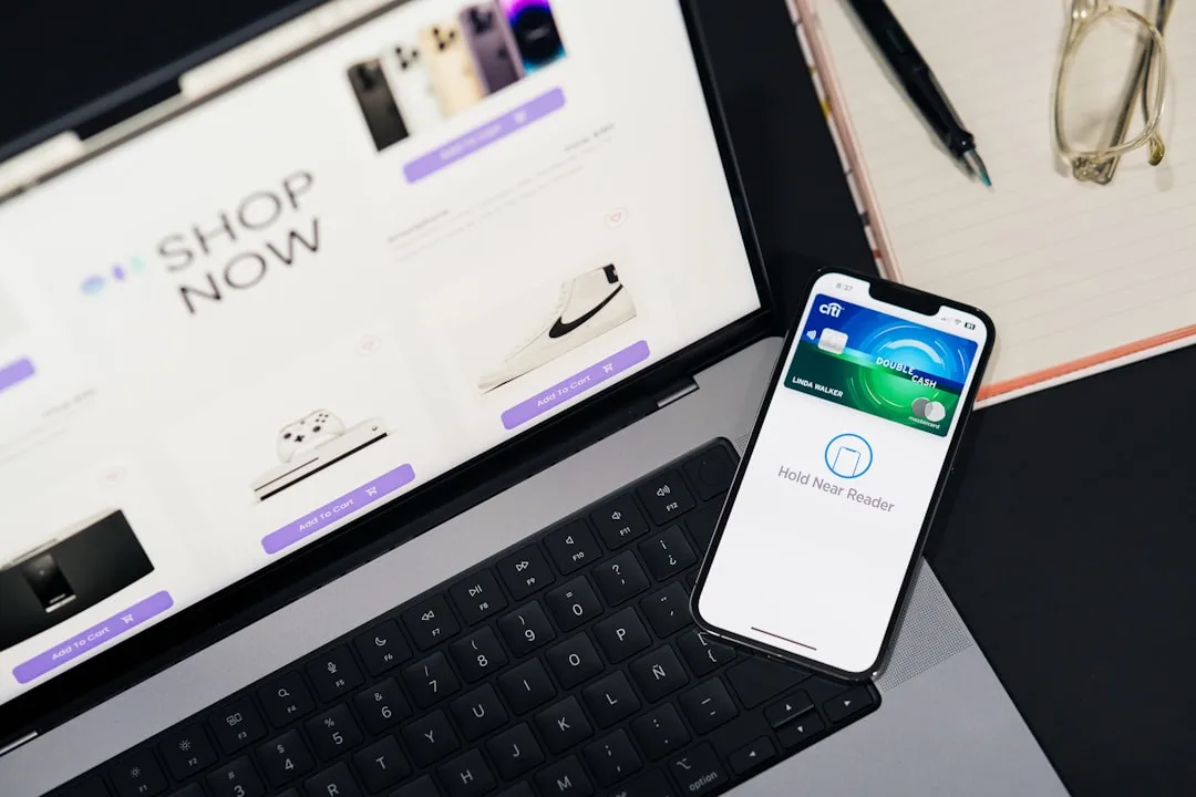 Desk with laptop showing ecommerce and mobile checkout